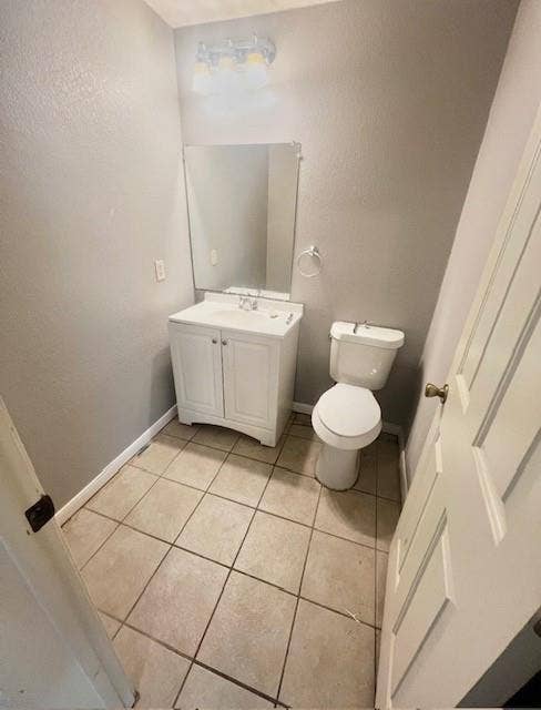 5205 Hudson Bend Road, Austin, TX 78734 White vanity with integrated sink, rectangular mirror, and neutral tile flooring