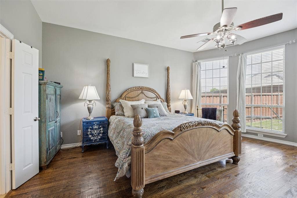 1000 Fenwick Lane, Forney, TX 75126 Wood-finish flooring, ample natural light from multiple windows, ceiling fan with integrated lighting, and neutral wall tones