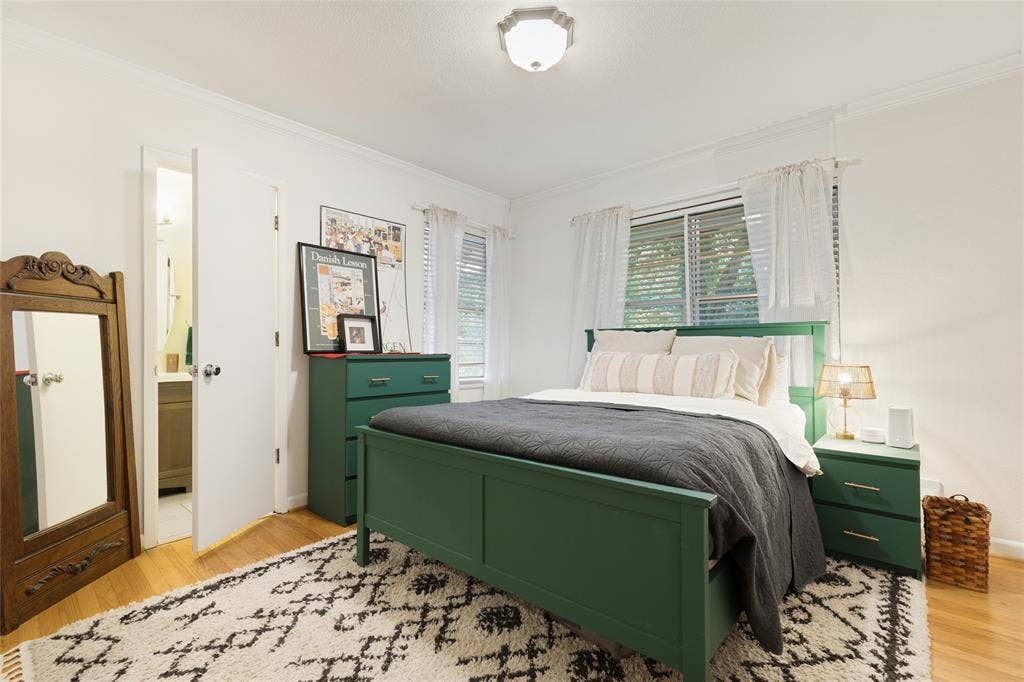 737 N Hampton Road, Dallas, TX 75208 Hardwood floors and generous natural light continue into the Guest Bedroom.