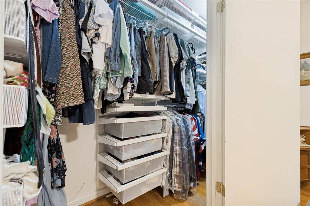 737 N Hampton Road, Dallas, TX 75208 The Primary Bedroom closet is outfitted with a highly functional Elfa shelving system.