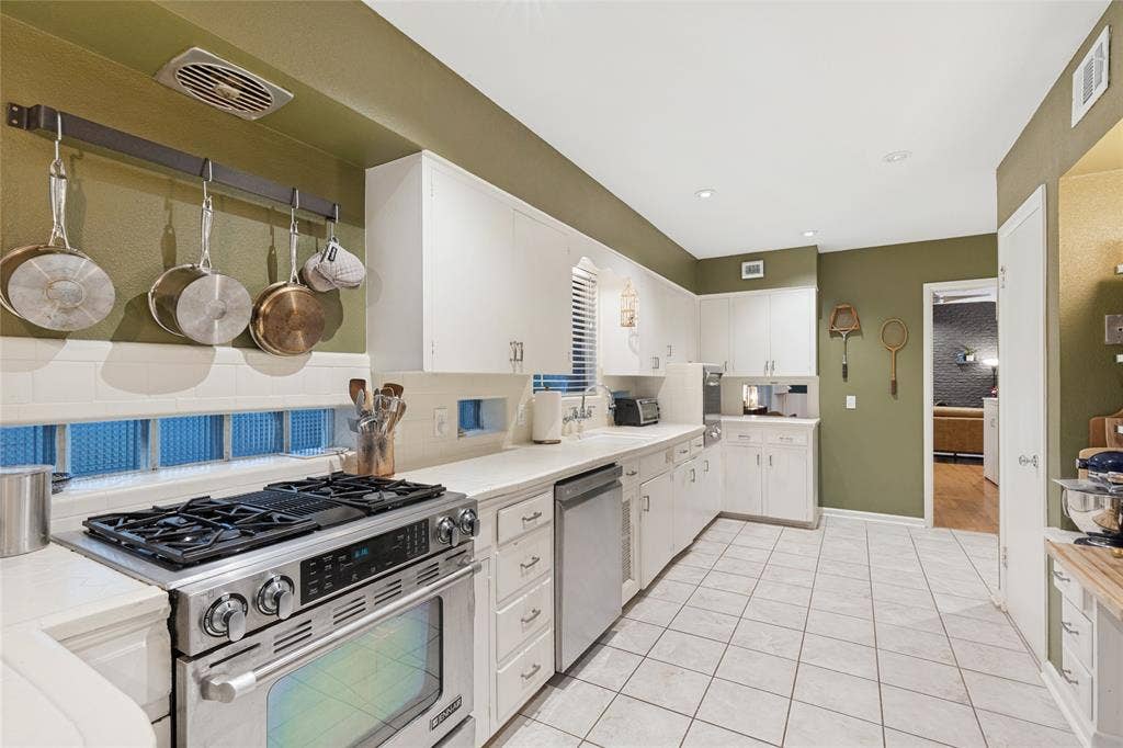 737 N Hampton Road, Dallas, TX 75208 An original built-in desk adds both function and vintage character to the Kitchen.