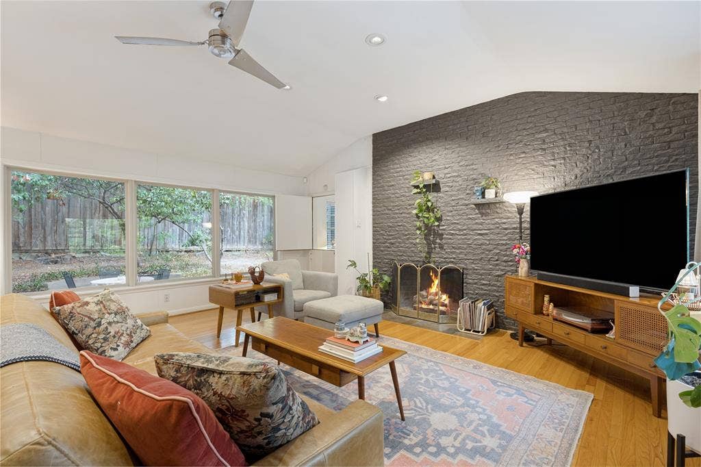 737 N Hampton Road, Dallas, TX 75208 Generous windows connect the Living Room to the surrounding trees and changing light.