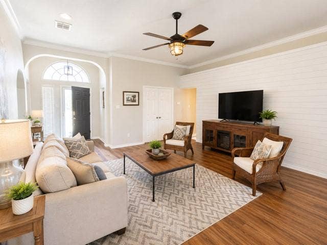 10201 Evergreen Drive, Rowlett, TX 75089 Living room with high ceiling, wood feature wall and wood-burning fireplace