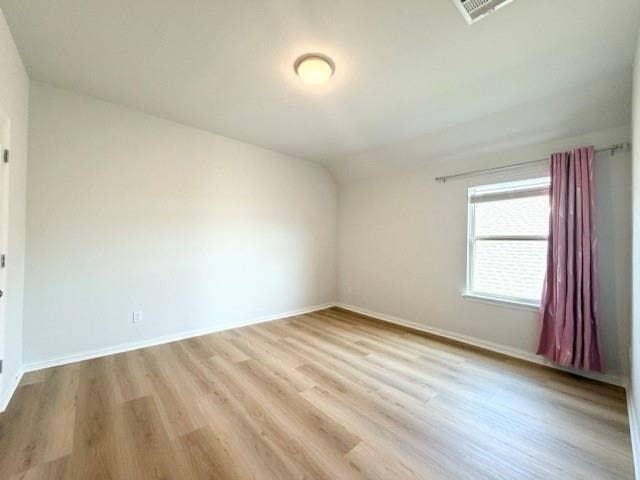 5609 Meritage Street, McKinney, TX 75070 Light wood-finish flooring, white walls, and a ceiling-mounted light fixture