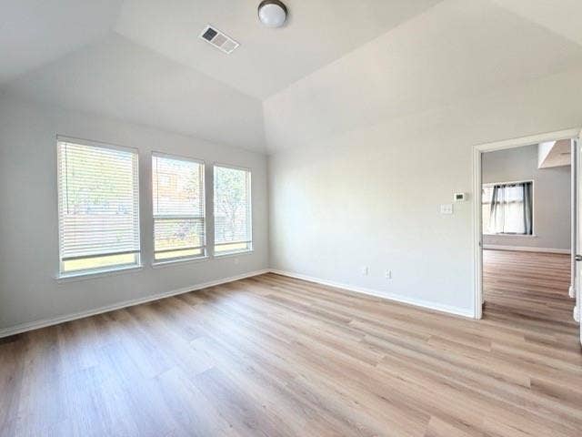 5609 Meritage Street, McKinney, TX 75070 Vaulted ceiling, wood-finish flooring, three large windows with blinds, recessed lighting, and a neutral color palette