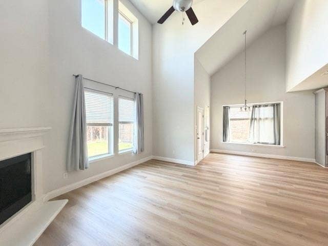5609 Meritage Street, McKinney, TX 75070 Vaulted ceilings with an exposed beam, wood-finish flooring, and a fireplace with a mantel