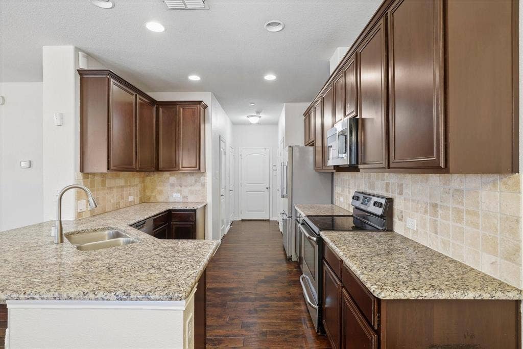 6529 Rutherford Road, Plano, TX 75023 Kitchen View (unstaged) with Viking Refrigerator showing which remains with the property.