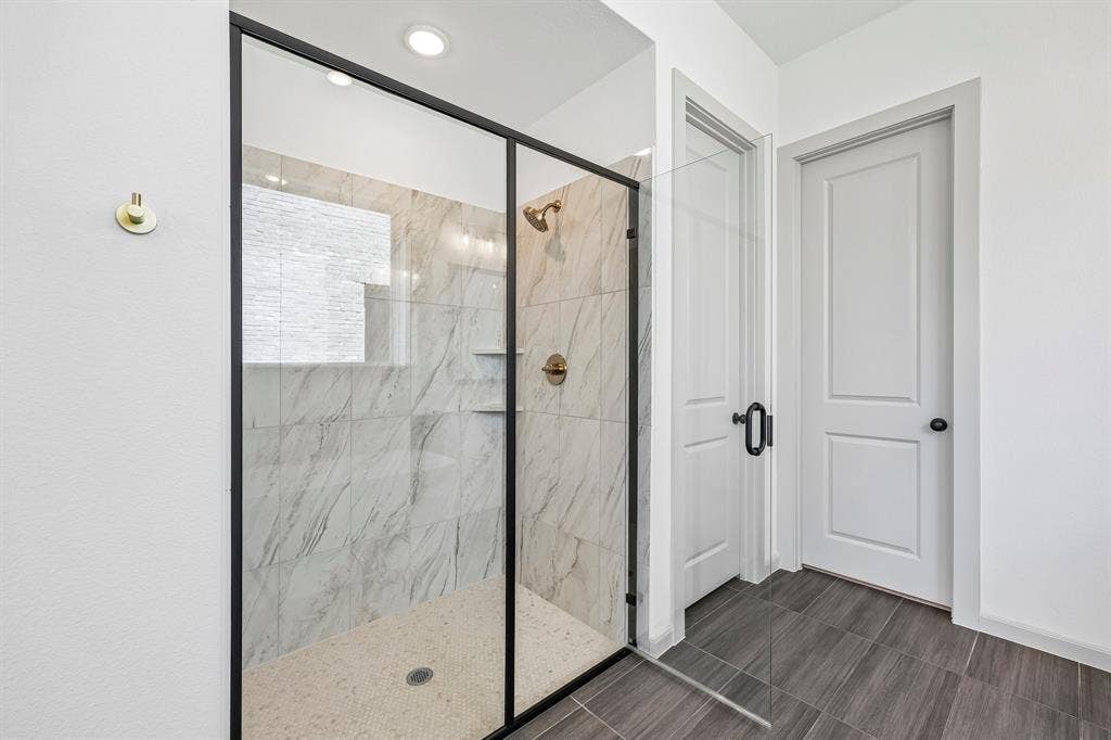 15828 Amber Street, Frisco, TX 75033 Your new owner's bath features a spacious walk in shower.