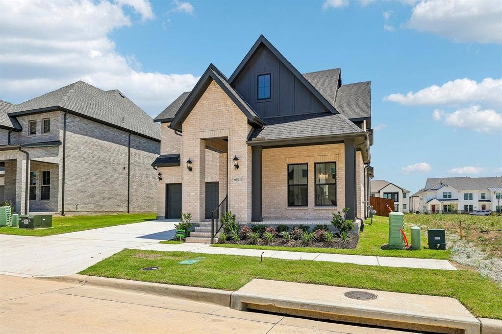 15828 Amber Street, Frisco, TX 75033 Featuring a charming front porch, dramatic gables and light colored brick paired with stunning dark trim, you'll enjoy fantastic curb appeal in this dream home!