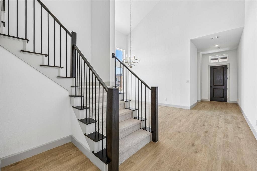 15828 Amber Street, Frisco, TX 75033 Offering a welcoming entry with a dramatic, wrought iron railing stair case and ample room to display art work, our Genevieve floor plan is the dream home you have been searching for!