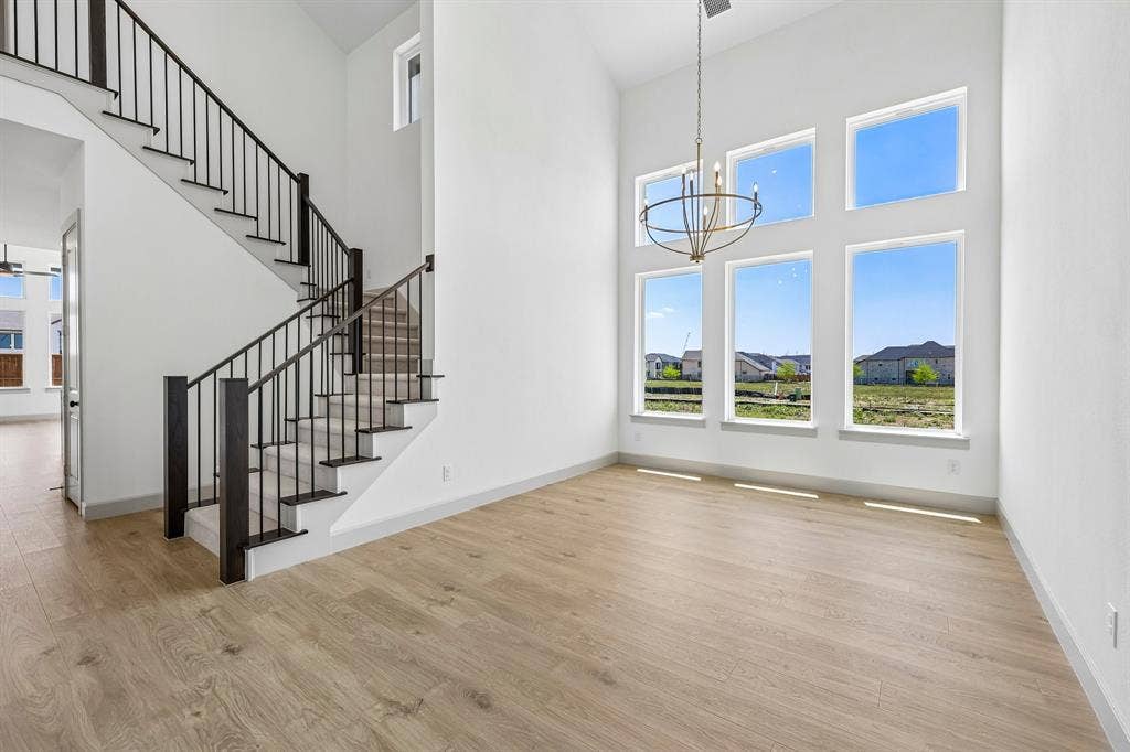 15828 Amber Street, Frisco, TX 75033 With soaring ceilings and a wall of windows, you'll love hosting grand dinner parties in this over the top dining room!