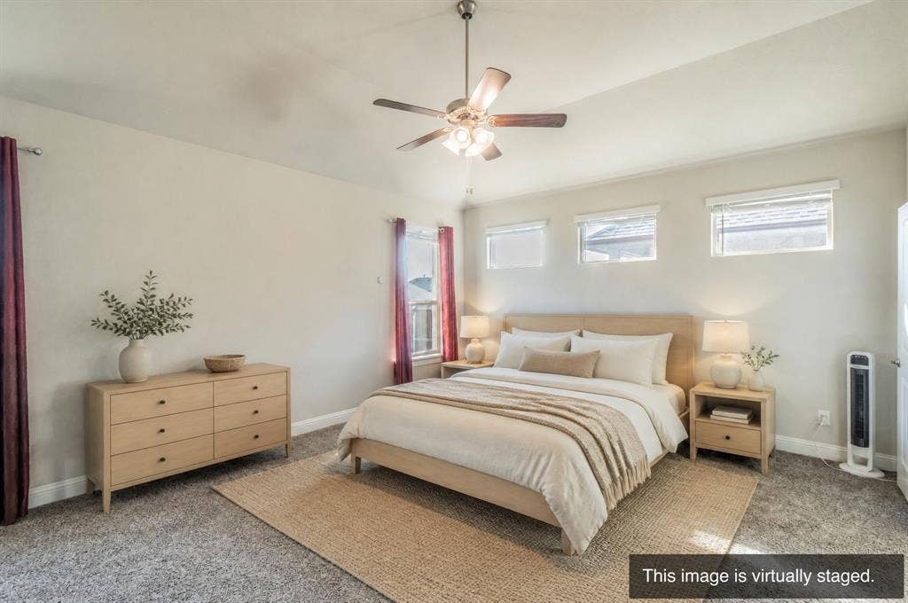 2041 St Andrews Way, Argyle, TX 76226 Spacious interior with neutral wall tones, textured carpeting, and a ceiling fan with integrated lighting