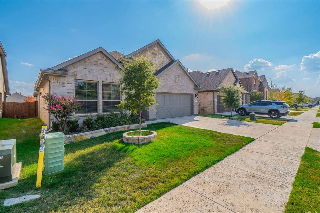 2041 St Andrews Way, Argyle, TX 76226 Brick and stone exterior with gabled roof lines