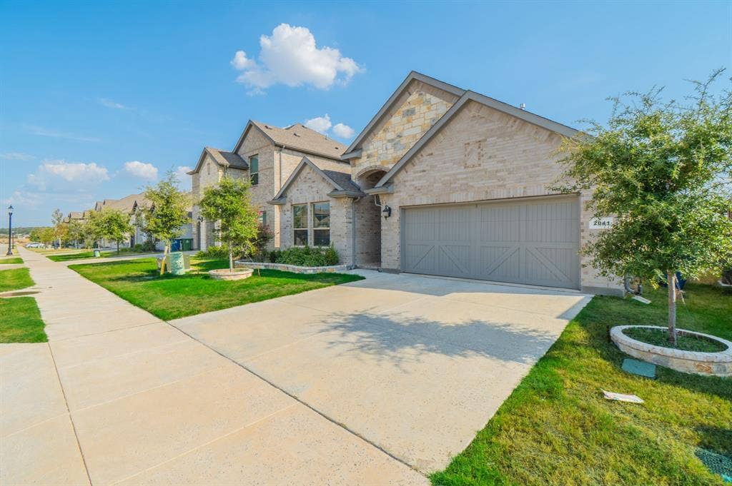 2041 St Andrews Way, Argyle, TX 76226 Brick and stone exterior with a gabled roof