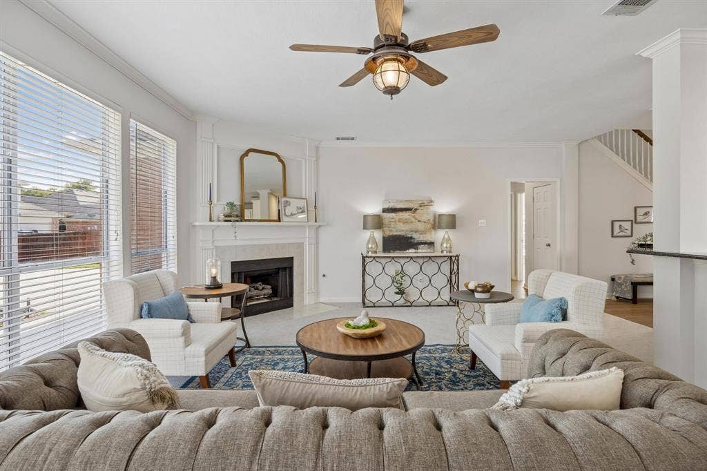 4424 Courtney Lane, Richardson, TX 75082 Gas fireplace and an abundance of natural light flow into the living room