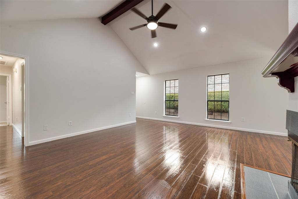 Vaulted ceiling with exposed beam, wood-finish flooring, recessed lighting, and a ceiling fan