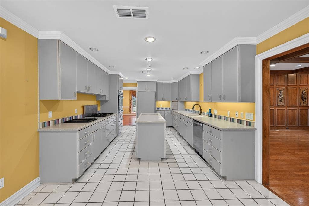702 Mulberry Drive, Athens, TX 75751 Galley kitchen featuring a gas range, integrated oven with two warming drawers, dishwasher, recessed lighting, a center island and a Sub-Zero refrigerator
