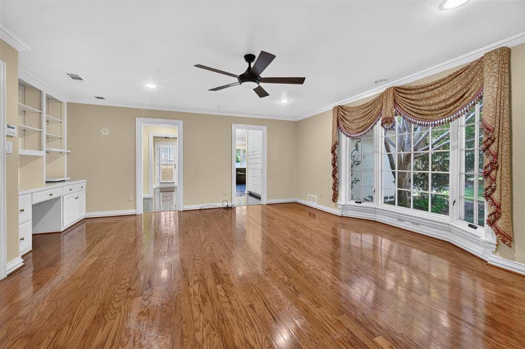 702 Mulberry Drive, Athens, TX 75751 Hardwood flooring, ceiling fan, recessed lighting, built-in shelving, and large bay window