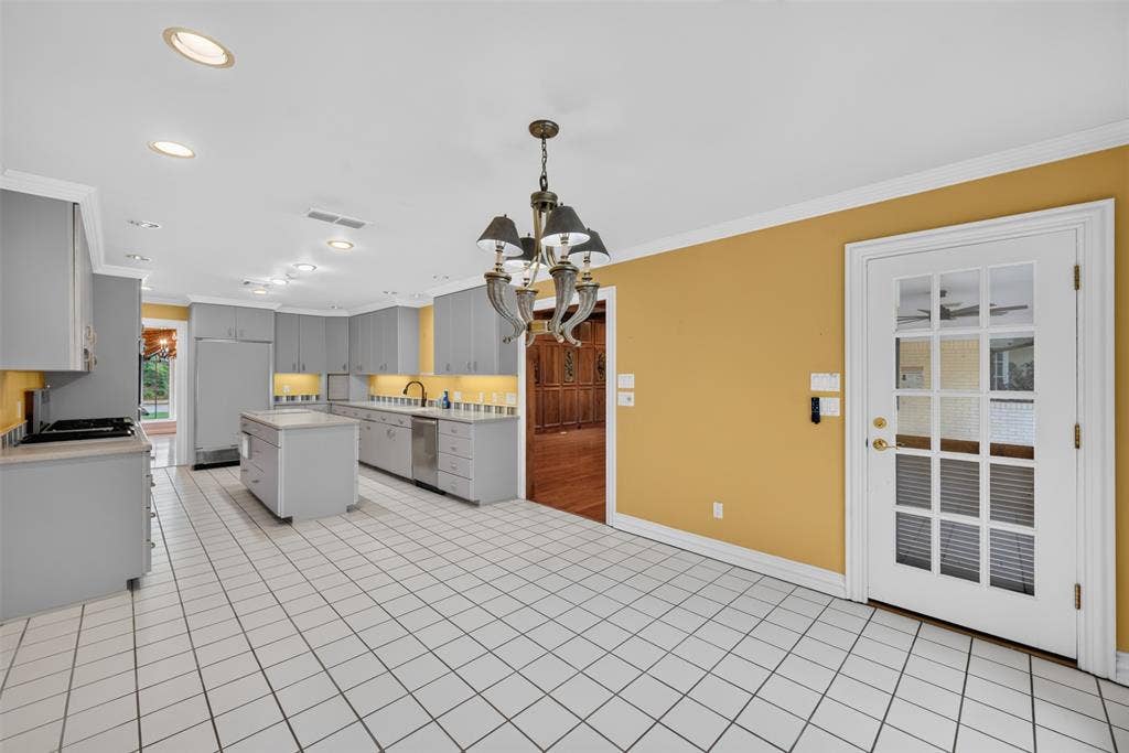 702 Mulberry Drive, Athens, TX 75751 Kitchen featuring an island, recessed lighting, tile flooring, gray cabinetry, and a full-light glass panel door