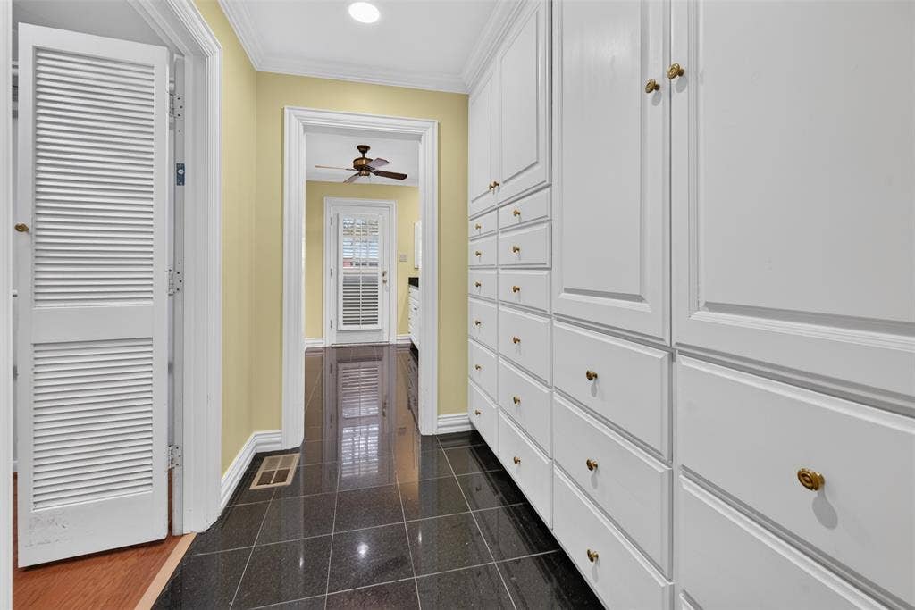 702 Mulberry Drive, Athens, TX 75751 Built-in white cabinetry with brass-toned hardware