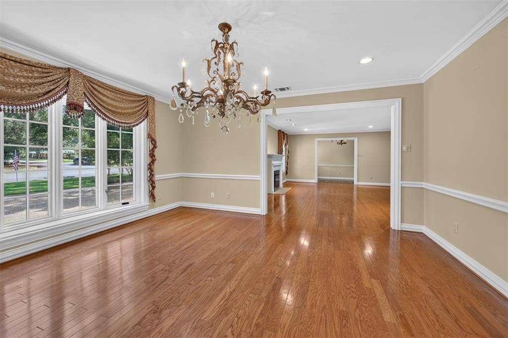 702 Mulberry Drive, Athens, TX 75751 Hardwood flooring, decorative chandelier, crown molding, wall trim, recessed lighting