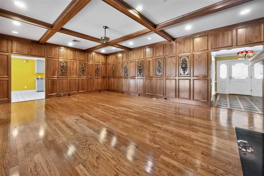 702 Mulberry Drive, Athens, TX 75751 Hardwood flooring, wood paneling, wood-beamed ceiling, recessed lighting, and a ceiling fan