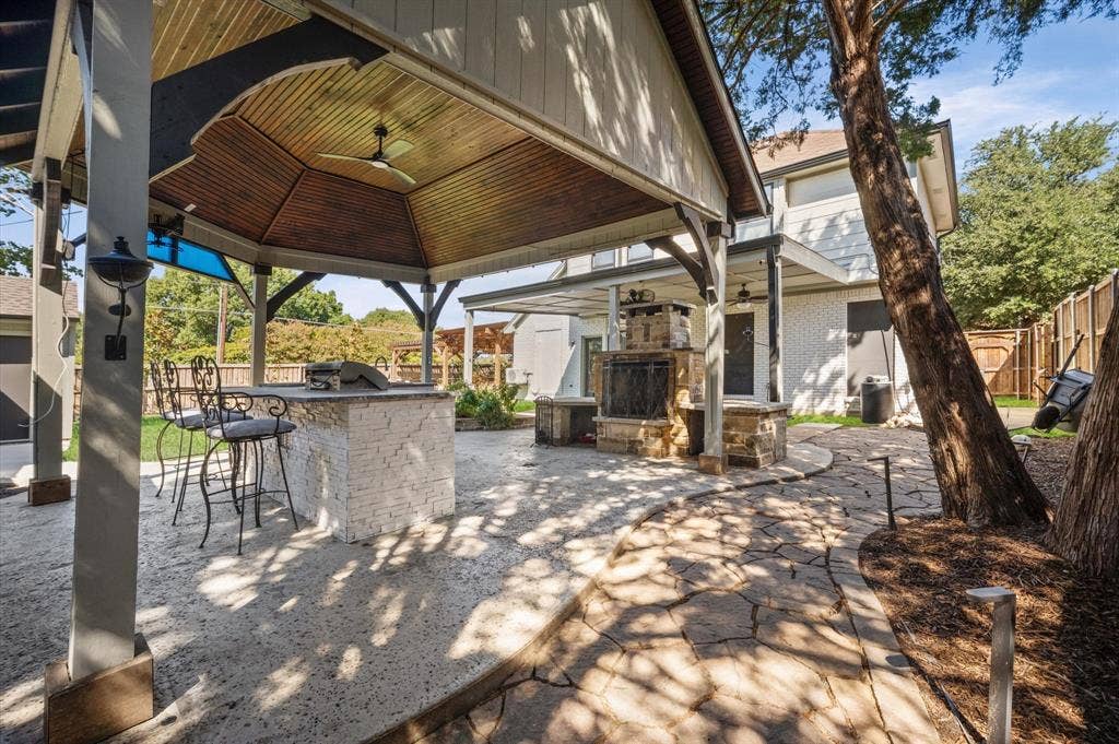 820 Raywood Circle, Plano, TX 75075 Patio with outdoor kitchen and fireplace