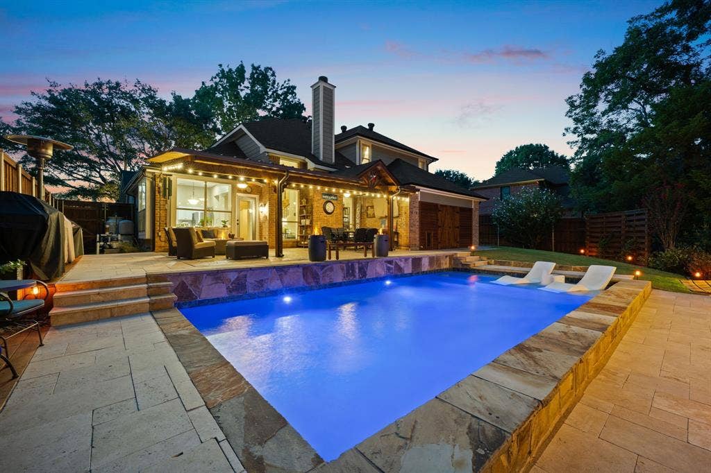 3202 Harbor Pointe Drive, Rowlett, TX 75088 Resort-style pool with tanning ledge, covered patio with dining and seating areas