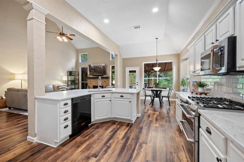 3202 Harbor Pointe Drive, Rowlett, TX 75088 Stunning kitchen remodeled in 2026 with stainless steel appliances, double oven, gas stove open to breakfast and living room