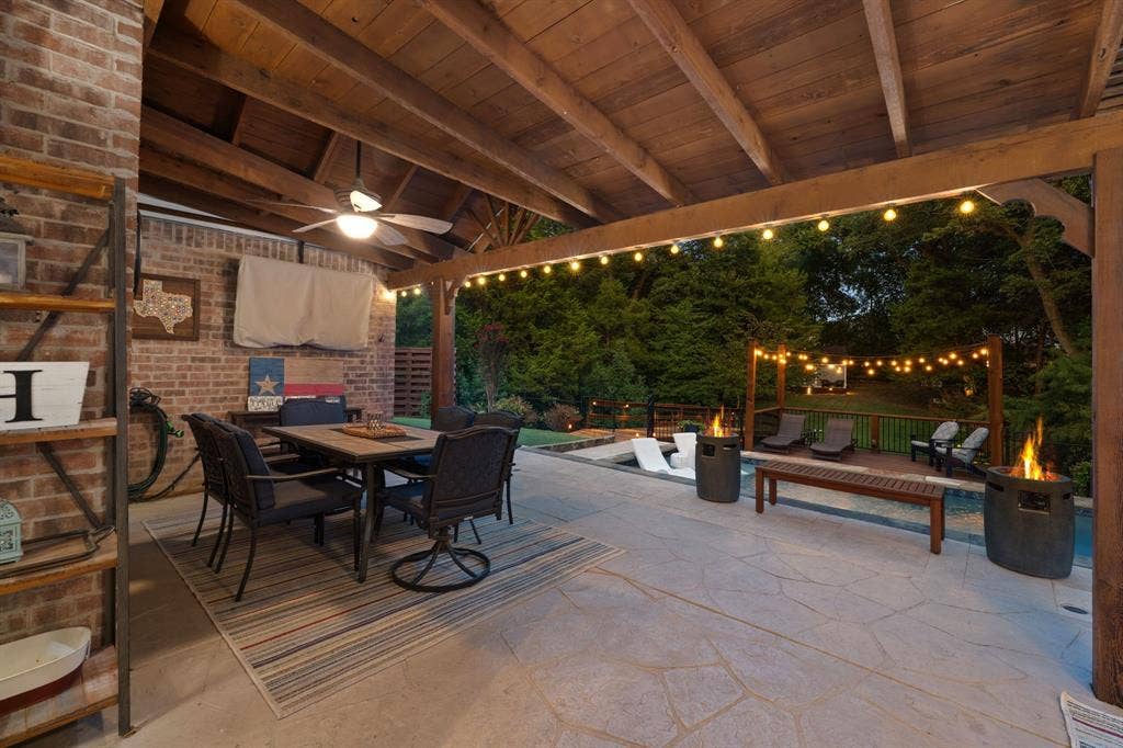3202 Harbor Pointe Drive, Rowlett, TX 75088 Covered patio with a wood-beam ceiling, stamped concrete patio with view of pool and backyard