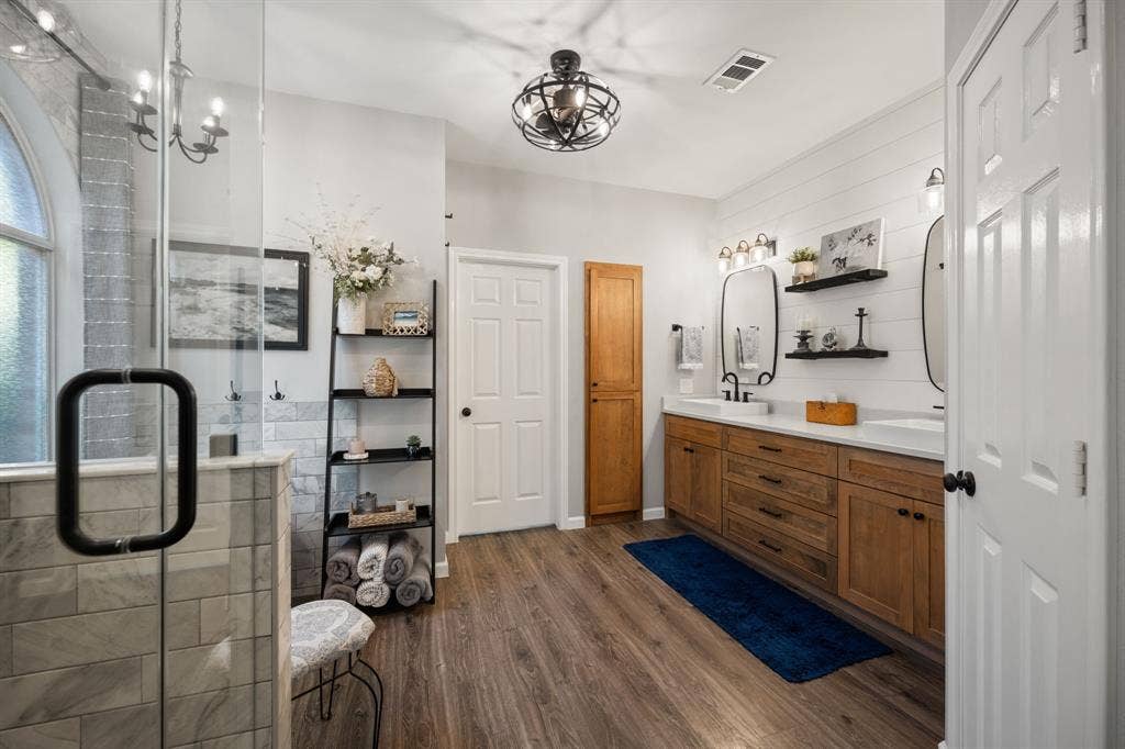 3202 Harbor Pointe Drive, Rowlett, TX 75088 Stunning primary bathroom remodeled in 2023 with freestanding tub, shower, wood vanity with double sinks