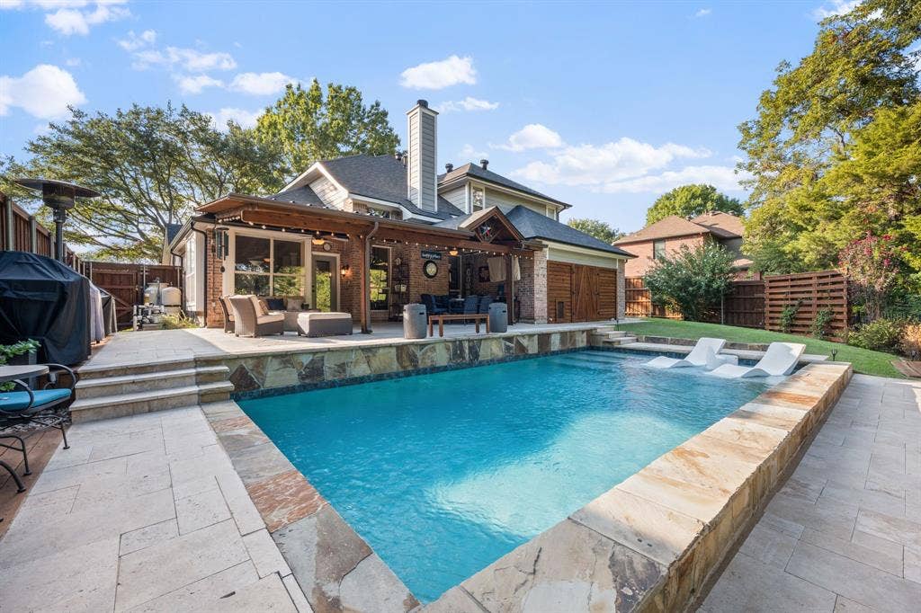 3202 Harbor Pointe Drive, Rowlett, TX 75088 Expansive backyard featuring a pool added in 2021 with pool chiller added in 2022 for hot summer days