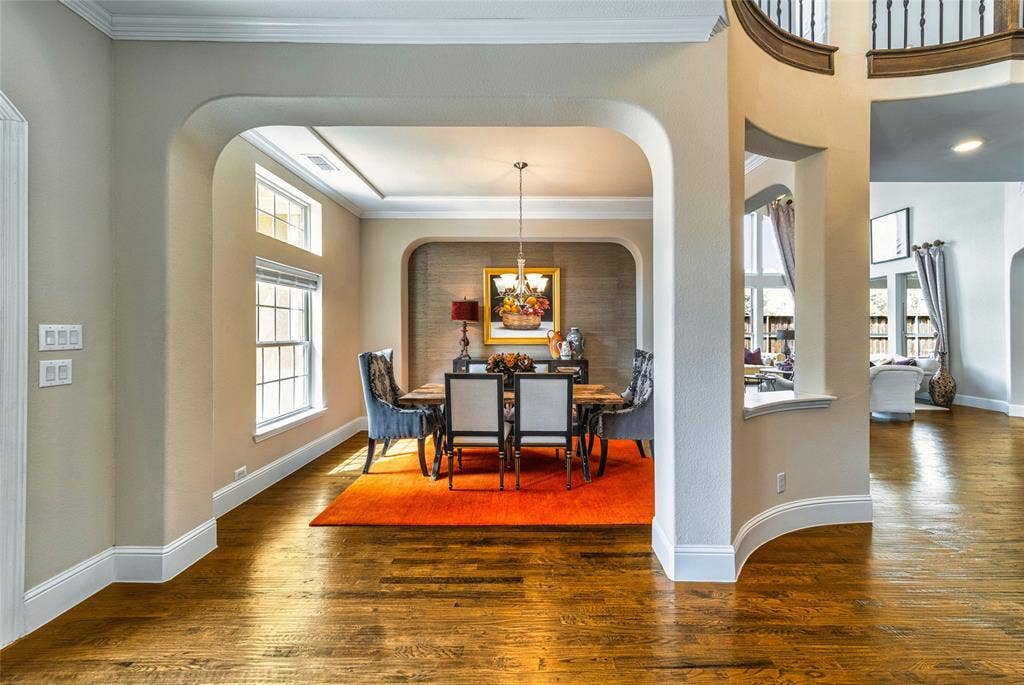 13018 Seattle Slew Street, Frisco, TX 75035 Hardwood flooring, arched doorways, crown molding, double-pane windows, and a built-in chandelier