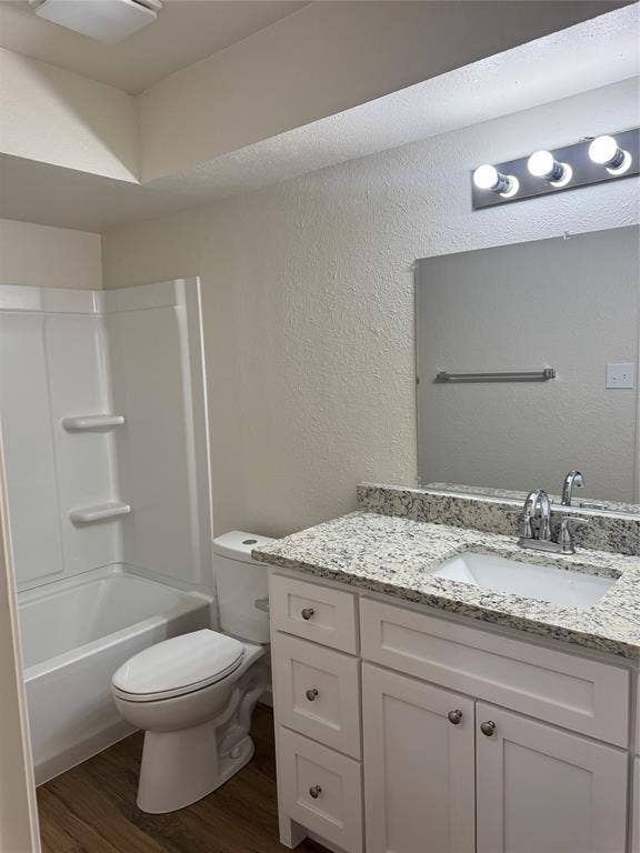 1104-1106 Mulkey Lane, Denton, TX 76209 White vanity with brushed nickel hardware, integrated sink, and a speckled countertop