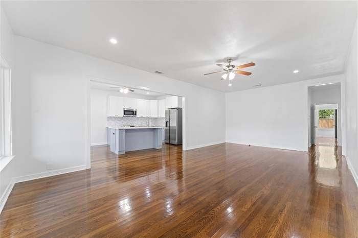 2405 Monroe Street, Commerce, TX 75428 Hardwood flooring, recessed lighting, and a ceiling fan