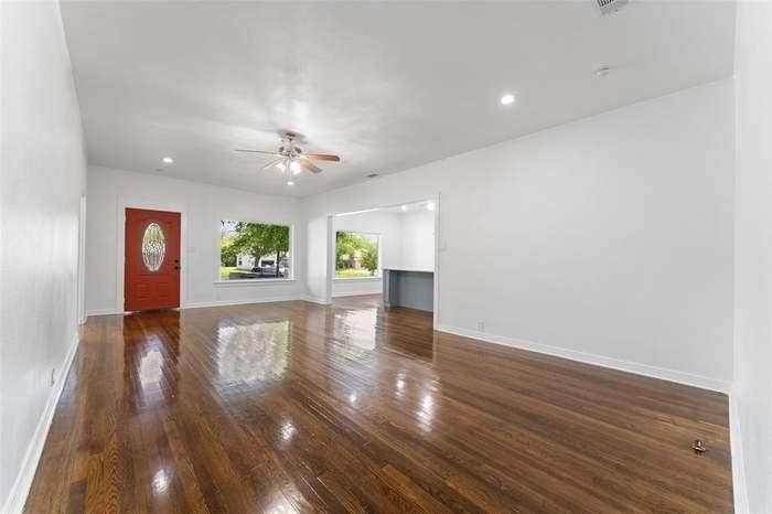 2405 Monroe Street, Commerce, TX 75428 Wood-finish flooring, recessed lighting, and a ceiling fan