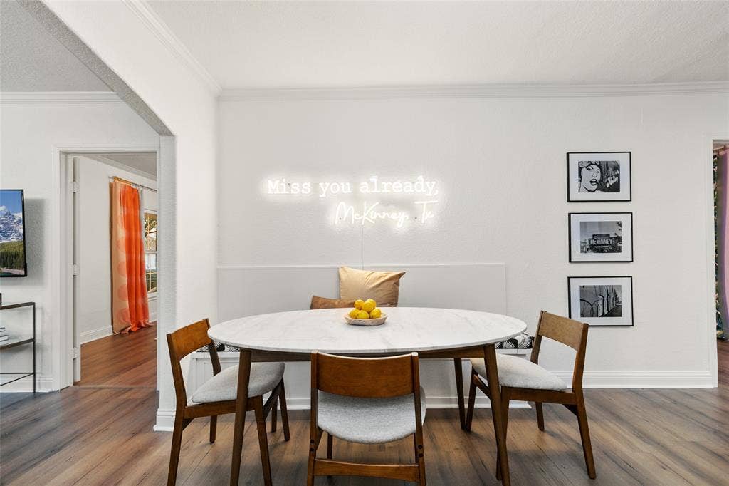 214 Short Street, McKinney, TX 75069 Wood-finish flooring throughout, white walls, and crown molding