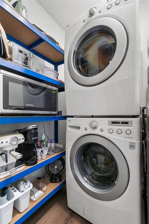 214 Short Street, McKinney, TX 75069 Stacked washer and dryer, blue shelving, wood-finish flooring