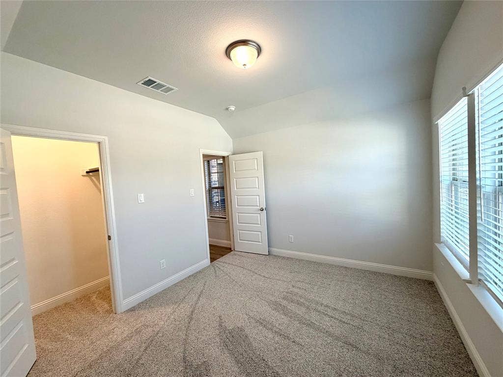 3806 Chicory Court, Melissa, TX 75454 Another view of the front secondary bedroom featuring a walk in closet.