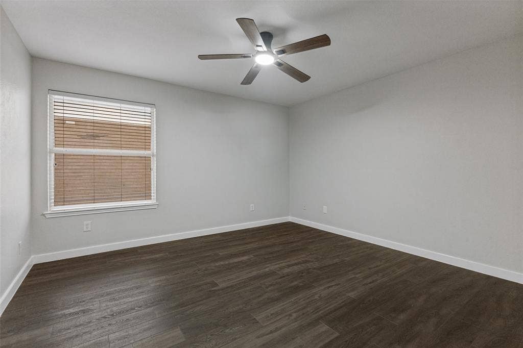 4215 Maidstone Drive, Garland, TX 75043 Neutral wall finishes, wood-finish flooring, and a ceiling fan with integrated lighting