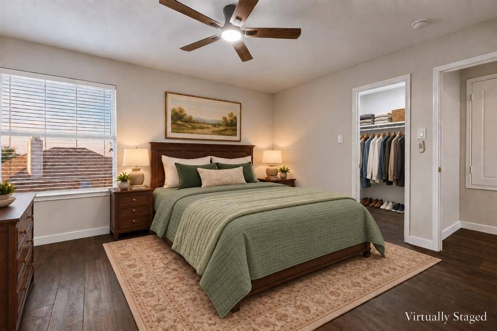 4215 Maidstone Drive, Garland, TX 75043 Wood-finish flooring, ceiling fan with integrated lighting, window with blinds, and a built-in closet with shelving and hanging space