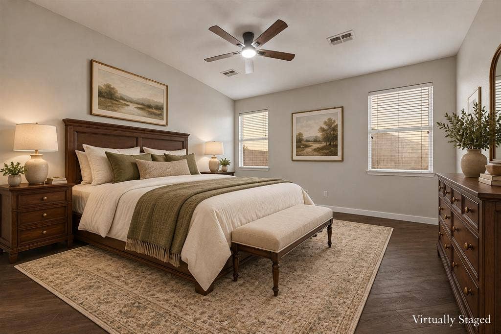 4215 Maidstone Drive, Garland, TX 75043 Primary bedroom with a ceiling fan with integrated lighting, wood-finish flooring, multiple windows with blinds.