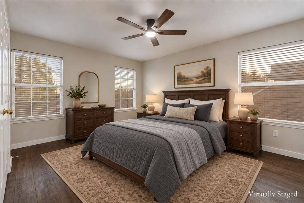 4215 Maidstone Drive, Garland, TX 75043 Hard-surface wood-finish flooring, white walls, three windows with blinds, and a ceiling fan with integrated lighting
