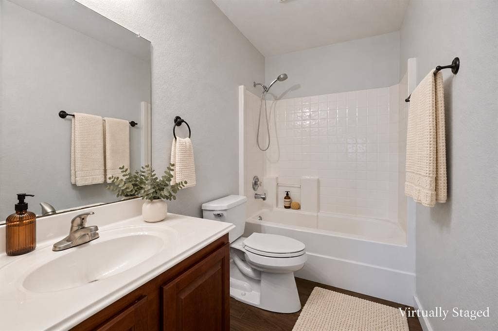 4215 Maidstone Drive, Garland, TX 75043 White vanity with an integrated sink and chrome faucet