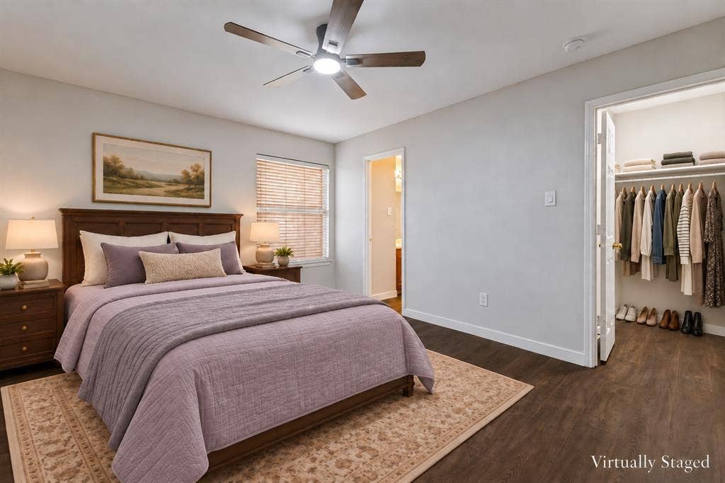 4215 Maidstone Drive, Garland, TX 75043 Wood-finish flooring, ceiling fan with integrated lighting, window with blinds, and built-in closet shelving