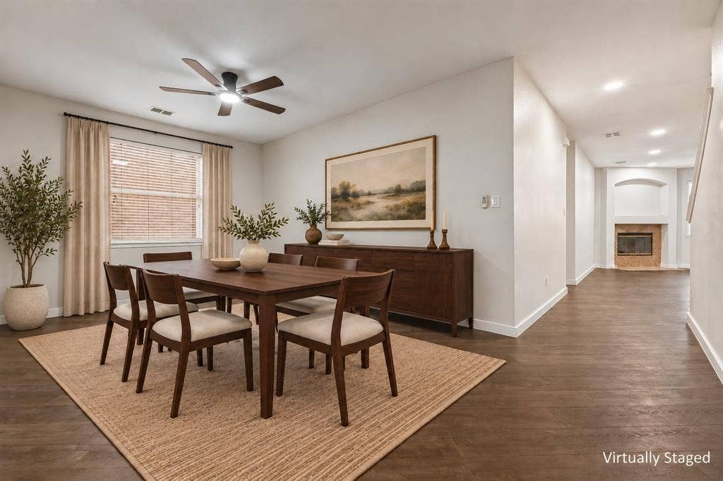 4215 Maidstone Drive, Garland, TX 75043 Spacious dining area featuring wood-finish flooring, a ceiling fan, and window with blinds