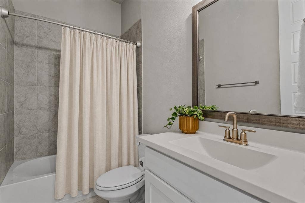 Downstairs full bathroom of 1302 20th St, Argyle, TX in Harvest by Hillwood