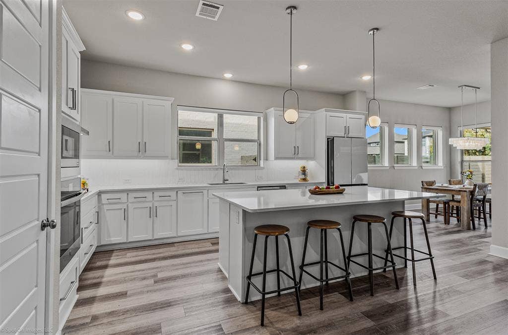 Large kitchen with kitchen island of 1302 20th St, Argyle, TX in Harvest by Hillwood