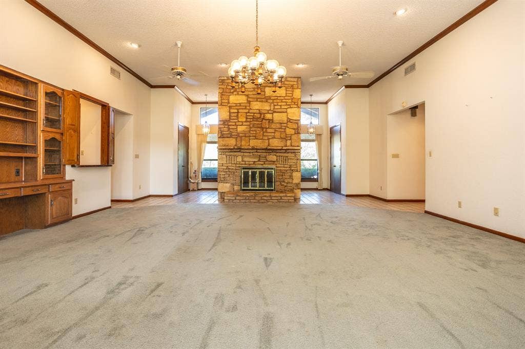 2300 W MAIN Street, Lancaster, TX 75146 Living area looking toward front. Built-ins and wet bar. 4 ceiling fans