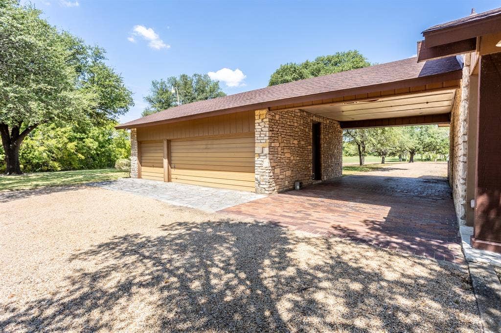 2300 W MAIN Street, Lancaster, TX 75146 Three garages has rear enter for privacy plus carport
